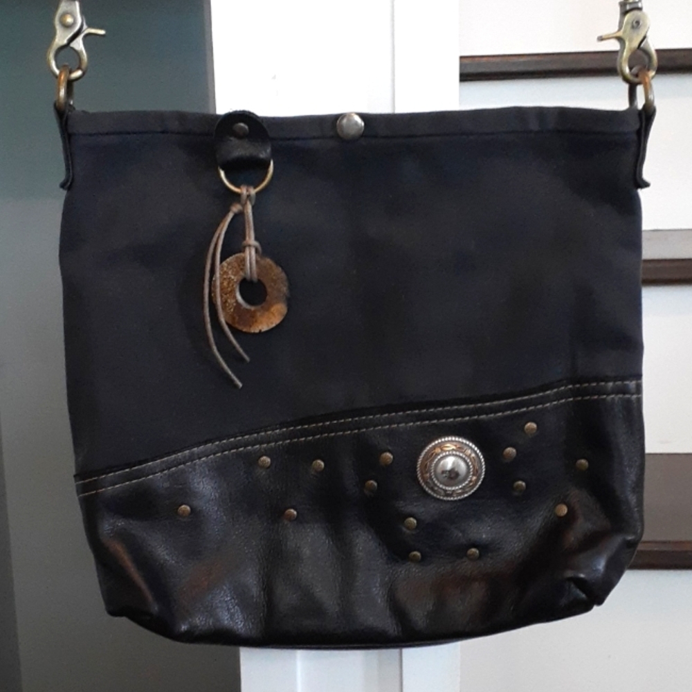^ Black canvas & leather artisan crossbody bag